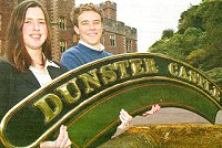 Katie JAmes and Nick Coates with the nameboard at Dunster Castle